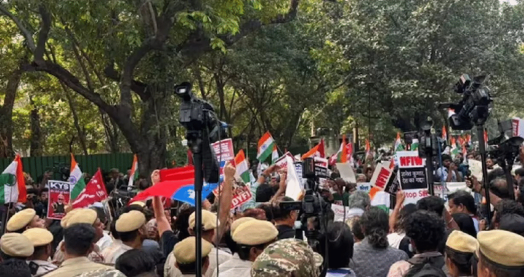 Demonstrators hold signs against SIR near Bangla Sahib in Delhi.