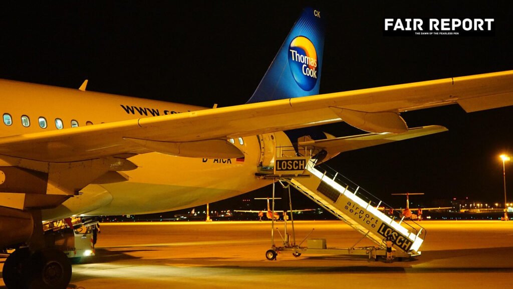 An airplane parked at a terminal, representing the launch of new IndiGo Udaipur flights.