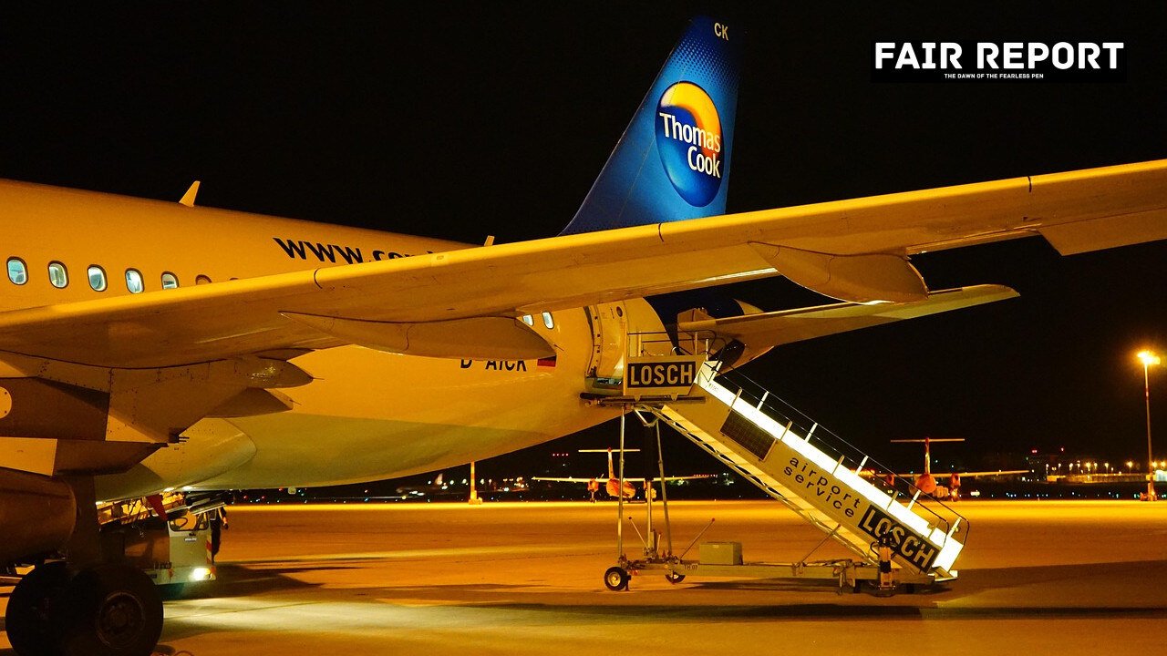 An airplane parked at a terminal, representing the launch of new IndiGo Udaipur flights.