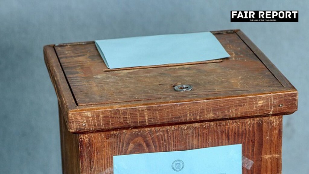 A close-up view of a metal ballot box representing the debate over a return to ballot papers in elections.